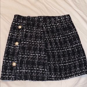 Black and white skirt with pearl buttons
